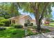 Inviting home exterior with a terracotta roof, manicured landscaping, and a shady front yard at 763 Via Milano, Apopka, FL 32712