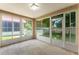 Enclosed lanai with views of the backyard, offering a versatile space for relaxation at 763 Via Milano, Apopka, FL 32712