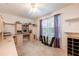 Bedroom featuring a large desk with shelving, a window, and neutral carpet at 7978 Se 174Th Belhaven Loop, The Villages, FL 32162