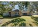 Lovely single-story home with stone facade, well-maintained lawn, and mature trees at 805 Leopard Trl, Winter Springs, FL 32708