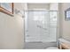 Bathroom featuring a shower-tub combo with sliding glass doors at 8276 Maritime Flag St # 110, Windermere, FL 34786