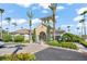 Elegant community clubhouse with lush landscaping, tall palm trees and ample parking at 8276 Maritime Flag St # 110, Windermere, FL 34786