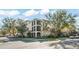 The exterior of the building features a well-manicured lawn and ample parking at 8276 Maritime Flag St # 110, Windermere, FL 34786