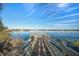 Picturesque wooden pier extending into a calm lake, offering a tranquil spot to relax and enjoy the waterfront scenery at 8276 Maritime Flag St # 110, Windermere, FL 34786