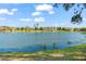 Expansive lake view with calm waters reflecting the clear blue sky, showcasing the serene and picturesque surroundings at 8276 Maritime Flag St # 110, Windermere, FL 34786