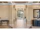 Elegant lobby with tile floors, columns and chandelier, creating a grand and welcoming entrance at 8276 Maritime Flag St # 110, Windermere, FL 34786