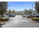 Large parking lot with easy access to shopping, surrounded by mature trees and manicured landscaping at 8276 Maritime Flag St # 110, Windermere, FL 34786