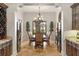 Elegant dining room featuring a chandelier, wine storage, and neutral decor at 9224 Bentley Park Cir, Orlando, FL 32819