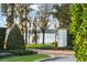 Beautiful driveway, featuring scenic views of the nearby lake, lush greenery, and mature trees at 9224 Bentley Park Cir, Orlando, FL 32819