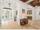 Inviting foyer with travertine flooring, a decorative ceiling, and elegant furnishings at 9224 Bentley Park Cir, Orlando, FL 32819