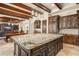 This kitchen island connects the dining and living spaces, with custom cabinets for storage and meal prep at 9224 Bentley Park Cir, Orlando, FL 32819