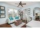 Comfortable home office featuring large windows, bookshelves, and natural light at 9224 Bentley Park Cir, Orlando, FL 32819