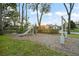 The playground is a great space for outdoor activities with a slide and swing set and houses visible in the background at 9224 Bentley Park Cir, Orlando, FL 32819