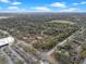 An aerial view showcasing the community's layout, landscaping, and nearby roads and parking areas at 940 Douglas Ave # 189, Altamonte Springs, FL 32714