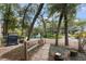 Serene backyard with a grill, hammock, mature trees and views of a pond and fountain at 940 Douglas Ave # 189, Altamonte Springs, FL 32714