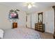 Bedroom featuring neutral walls, closet, and dresser; designed for optimal comfort and versatile living at 940 Douglas Ave # 189, Altamonte Springs, FL 32714