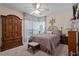 Cozy bedroom with natural light from the window, ceiling fan, and tasteful decor for a serene ambiance at 940 Douglas Ave # 189, Altamonte Springs, FL 32714