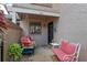 Cozy front porch with a swing, bench, potted plants, and a decorated front door at 940 Douglas Ave # 189, Altamonte Springs, FL 32714