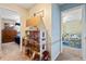 Bright hallway featuring a dollhouse between bedrooms, ceiling fans, and carpeted flooring at 940 Douglas Ave # 189, Altamonte Springs, FL 32714