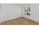 Bright bedroom with wooden floor and a large window at 9516 Darien Ave # 9516, Orlando, FL 32817