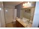 Lovely bathroom featuring double sinks, shower and bathtub combination, and granite countertops at 954 Lockbreeze Dr, Davenport, FL 33897