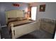 Cozy bedroom with patterned bedding and a classic bedside table setup for a relaxing retreat at 954 Lockbreeze Dr, Davenport, FL 33897