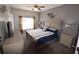 Inviting bedroom with coordinated decor, including a dresser and neutral carpet at 954 Lockbreeze Dr, Davenport, FL 33897