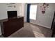 Cozy ' bedroom featuring a dresser, themed decor, and a bright window at 954 Lockbreeze Dr, Davenport, FL 33897