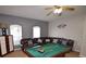 Spacious game room with a pool table, seating and lots of space to enjoy at 954 Lockbreeze Dr, Davenport, FL 33897