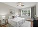 Bright bedroom with wood floors, a large window, and neutral decor at 11866 Barletta Dr, Orlando, FL 32827