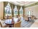 Bright and open common area with ample seating and large windows at 11866 Barletta Dr, Orlando, FL 32827