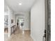 Inviting entryway with tile flooring, arched doorways, and views of the living spaces at 11866 Barletta Dr, Orlando, FL 32827