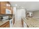 Spacious kitchen featuring granite countertops, stainless steel appliances, and ample cabinet space at 11866 Barletta Dr, Orlando, FL 32827