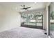 Screened lanai provides a great view of the lush, tropical landscaping and a ceiling fan for airflow at 11866 Barletta Dr, Orlando, FL 32827