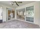 Spacious lanai showcases sliding glass doors to the home's interior and views of the exterior landscaping at 11866 Barletta Dr, Orlando, FL 32827