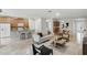 Spacious living room with a modern kitchen, dining area, and comfortable seating at 11866 Barletta Dr, Orlando, FL 32827