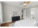 Comfortable main bedroom with hardwood floors, ceiling fan, and ample closet space at 11866 Barletta Dr, Orlando, FL 32827