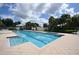 Community swimming pool with clear blue water and ample seating at 11866 Barletta Dr, Orlando, FL 32827