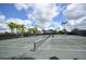 Well-maintained community tennis courts with lights and professional nets at 11866 Barletta Dr, Orlando, FL 32827
