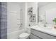 Bright bathroom with a shower-tub combo, fresh white tiles, and modern sink at 1507 Fountain View St, Ormond Beach, FL 32174