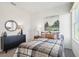 Bedroom with a bed, dresser, and artwork; a haven of relaxation and style at 1507 Fountain View St, Ormond Beach, FL 32174