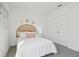 Bright bedroom with a bed, soft carpet, and a double door closet at 1507 Fountain View St, Ormond Beach, FL 32174