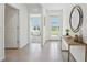 Bright foyer showcasing tile floors, view into other rooms, and a decorative console table at 1507 Fountain View St, Ormond Beach, FL 32174