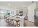 Modern kitchen with granite countertops, stainless steel appliances, and ample seating at the island at 1507 Fountain View St, Ormond Beach, FL 32174