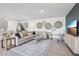 Open-concept living room featuring a comfortable sectional sofa and stylish wall decorations at 1507 Fountain View St, Ormond Beach, FL 32174