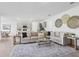 Bright living room with modern furnishings, including a plush sectional sofa and glass coffee table at 1507 Fountain View St, Ormond Beach, FL 32174