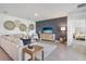 Bright living room featuring stylish decor, a large sectional, and a modern entertainment center at 1507 Fountain View St, Ormond Beach, FL 32174