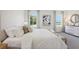 Bright main bedroom featuring a large comfortable bed, decorative pillows, and large windows at 1507 Fountain View St, Ormond Beach, FL 32174
