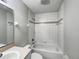 Clean bathroom featuring a bathtub, shower combination and neutral colors at 15525 Seymour Ln, Groveland, FL 34736