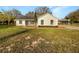 Exterior of home featuring a well-maintained lawn, landscaping and car port at 15525 Seymour Ln, Groveland, FL 34736